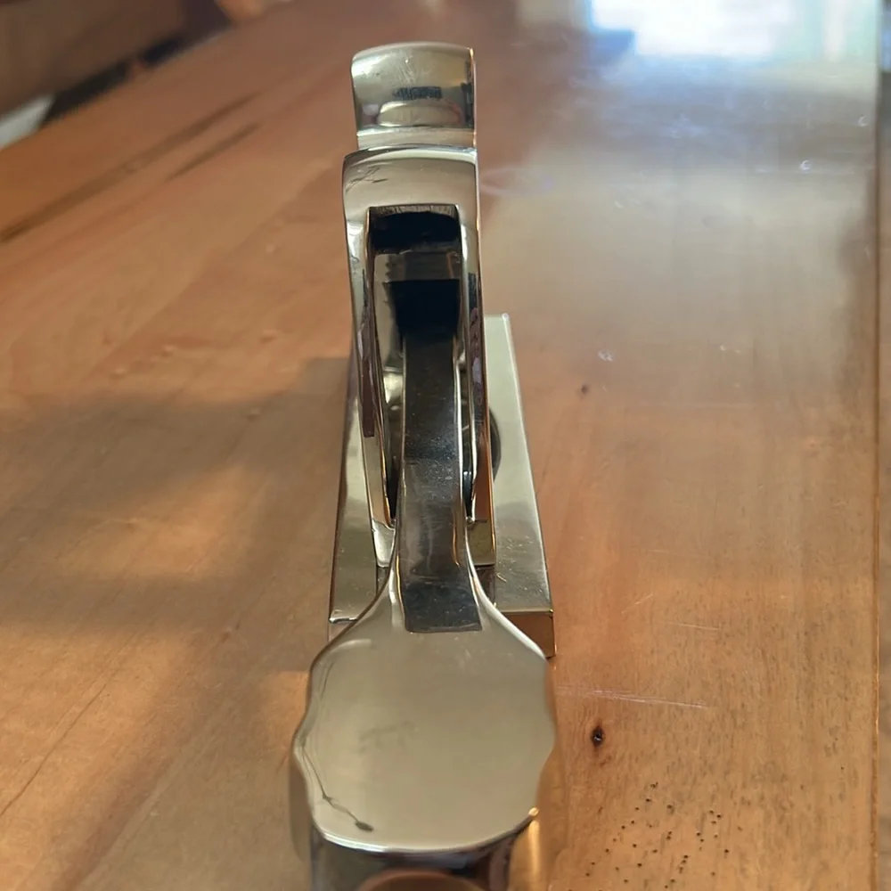 Crate and Barrel chromed squirrel nutcracker. Never used. Still has sticker.